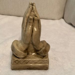 Ceramic praying hands can be used as 1 book holder